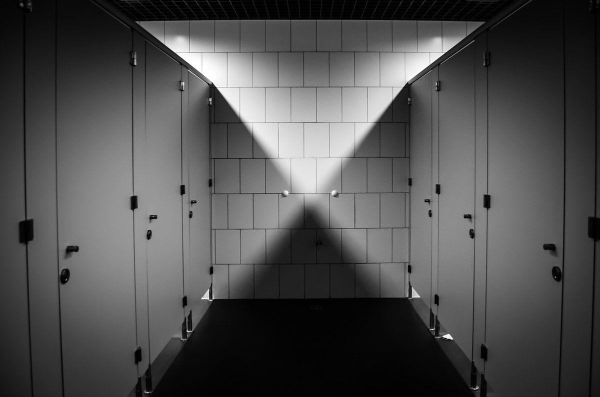Row of toilet cubicles with lockable doors in gender neutral washrooms